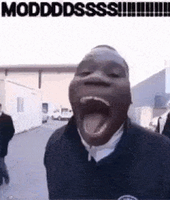 a man is making a funny face with his mouth open and his tongue hanging out .