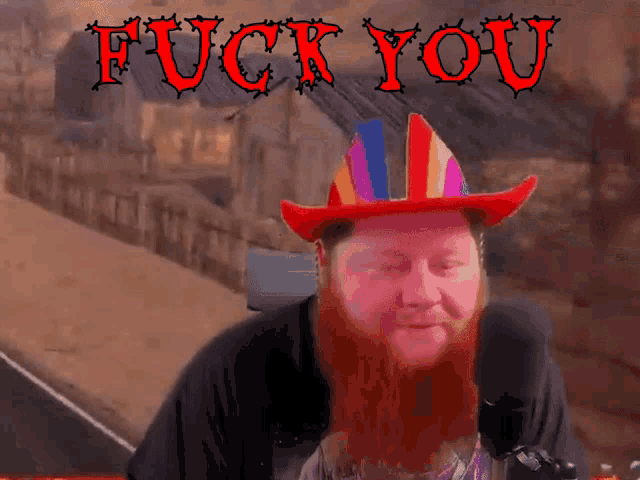 a man with a red beard wearing a cowboy hat with the words fuck you behind him