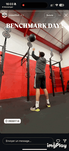 a man is doing a benchmark day exercise with a ball