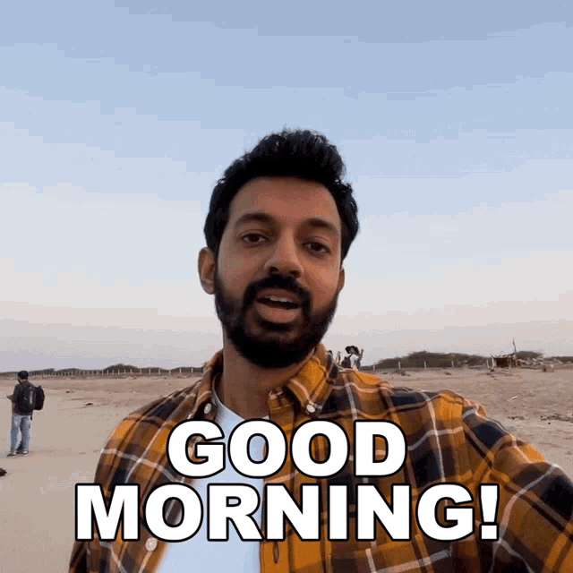 a man with a beard says good morning