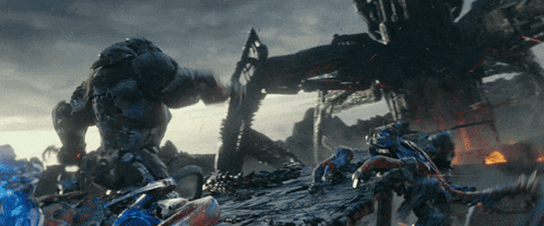 a group of robots are fighting each other in a dark scene