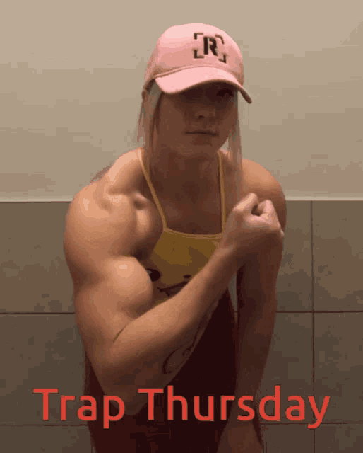 a woman flexing her muscles with the words trap thursday in red