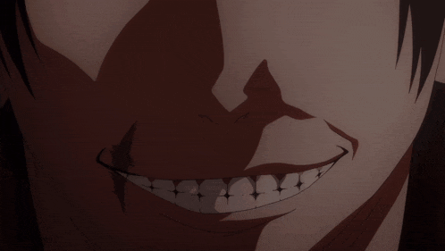 a close up of a person 's face with a large smile on it