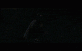 a pixelated image of a man 's face with a dark background