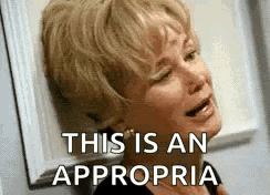 a woman is leaning against a wall and crying with the words `` this is an appropriate '' written on her face .