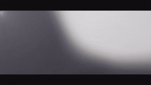 a gray background with a shadow on it