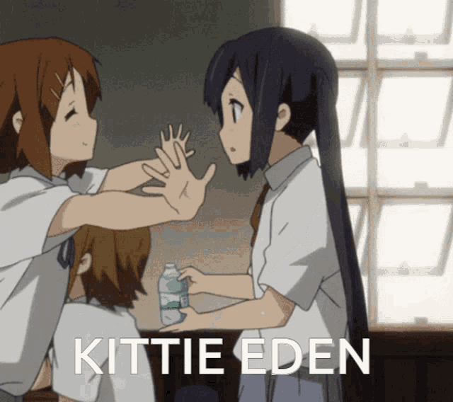 a picture of a girl giving another girl a high five with the words kittie eden below it