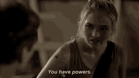 a woman says " you have powers " in front of a man