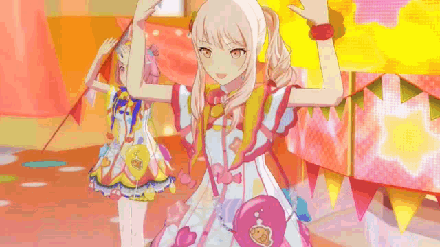 two anime girls are standing next to each other on a stage in front of a pink curtain .