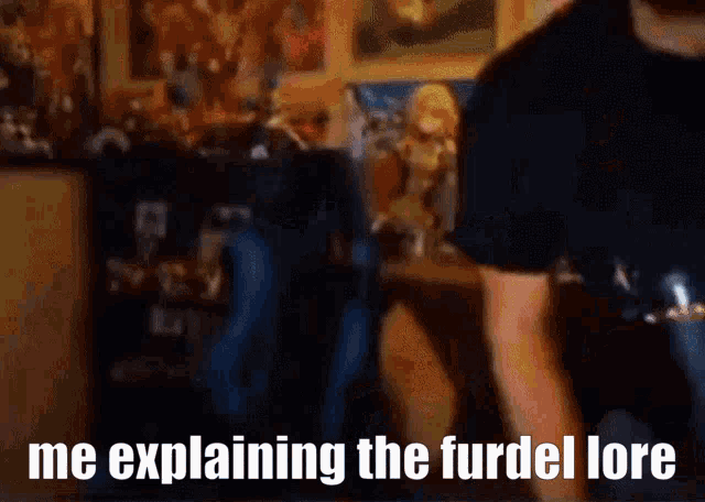 a man in a black shirt is standing in a room and explaining the furdel lore