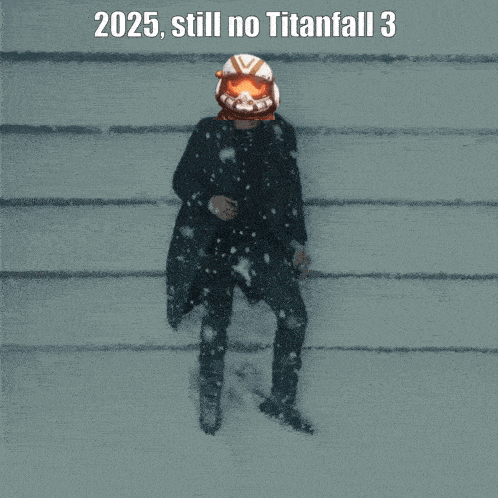 a man in a suit and helmet is standing in the snow with the text 2025 still no titanfall 3 above him