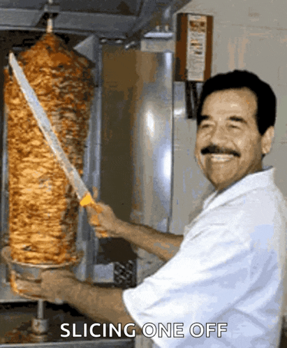 a man is smiling while holding a large knife in front of a machine that says ' slicing one off ' on it
