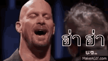 a bald man is making a funny face with his mouth open and his eyes closed .
