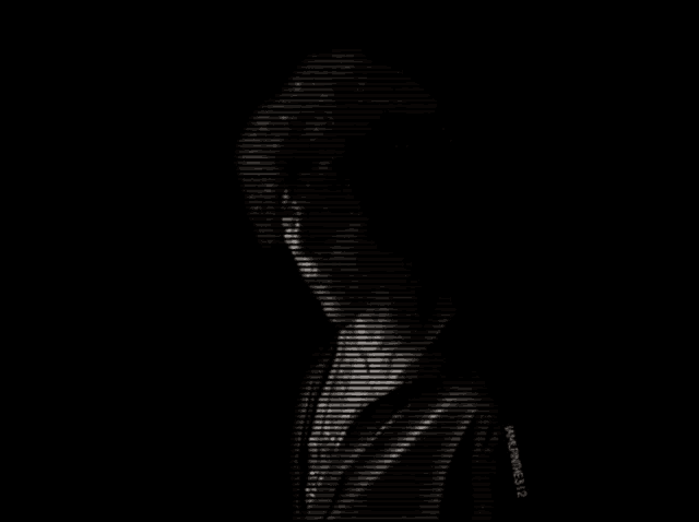 a black and white photo of a person with a hood on .