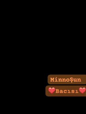 a woman taking a selfie next to a message that says minnosun