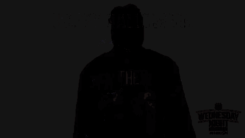 a man is wearing a jason voorhees mask and a hockey jersey .