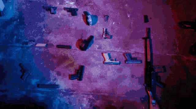 a bunch of guns are displayed in a purple and blue background