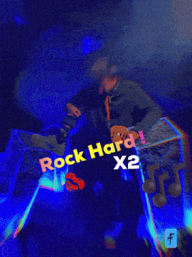 a man in a dark room with the words rock hard x2 below him