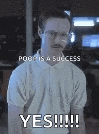 a man with glasses and a mustache is saying poop is a success yes !!!