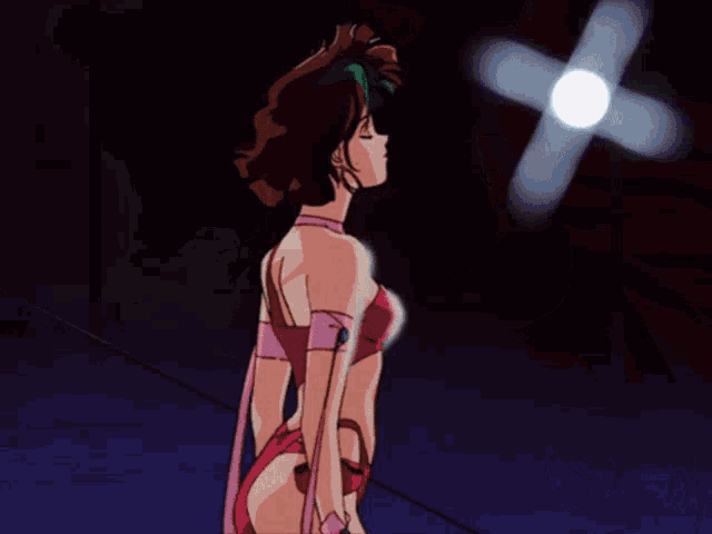 a woman in a red dress is standing in front of lights