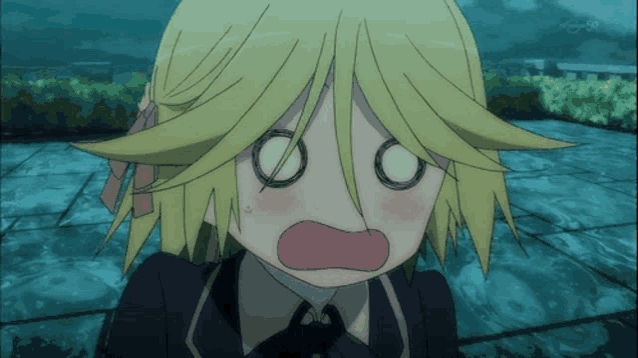 a girl with blonde hair is making a surprised face with her eyes closed