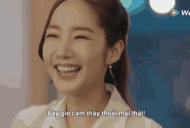 a close up of a woman 's face with a foreign language caption