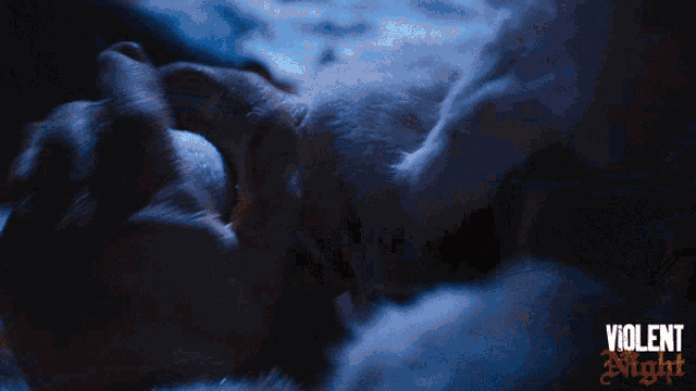a poster for violent night shows a dog laying on the ground