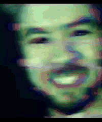 a pixelated image of a man 's face with a beard