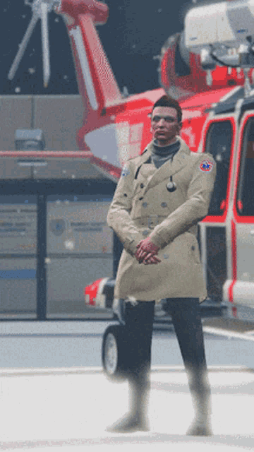a man in a trench coat is standing in front of a red helicopter