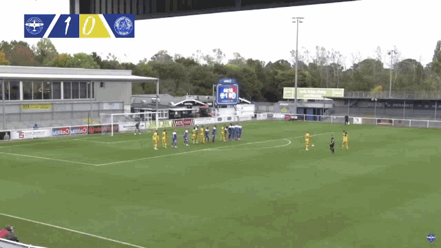 a soccer game is being played and the score is 10 to 0