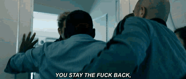 a man says " you stay the fuck back " in a movie