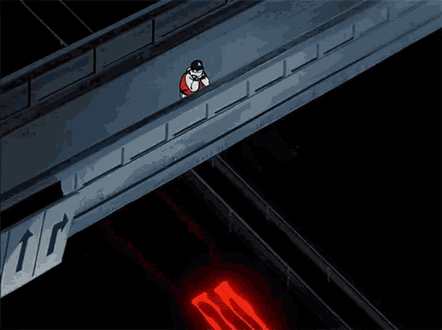 a person is standing on a bridge over a highway with red lights