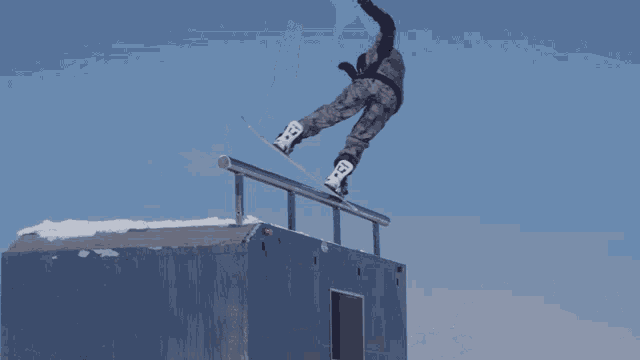 a person on a snowboard with the letter x on the board