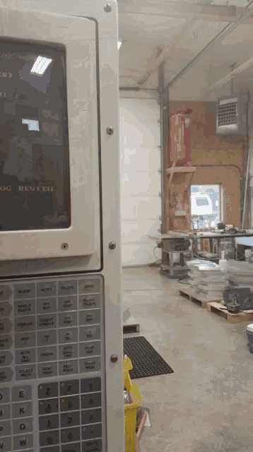 a machine in a warehouse has a screen that says " abc " on it