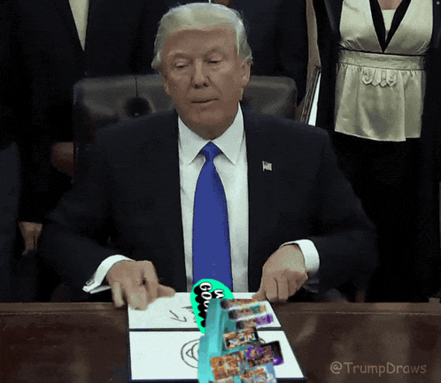 a man in a suit and tie is sitting at a desk with a drawing on it that says ' you ' on it