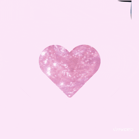 a woman 's face is surrounded by a pink heart shaped frame