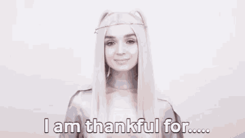 a woman with long white hair is saying `` i am thankful for ... ''
