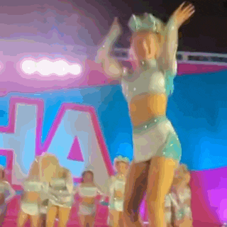 a group of cheerleaders are performing on a stage in front of the word ha