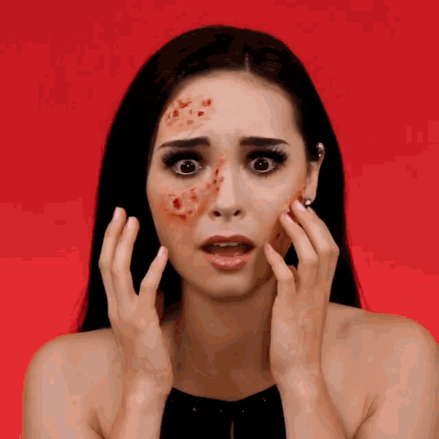 a woman with a scar on her face looks shocked