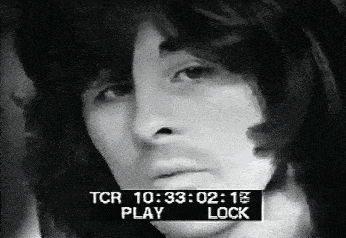 a black and white photo of a man 's face with a tcr 10 : 33 : 02 : 15 play lock