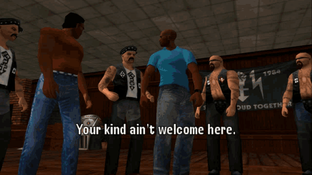 a group of men are standing in front of a sign that says your kind ain 't welcome here