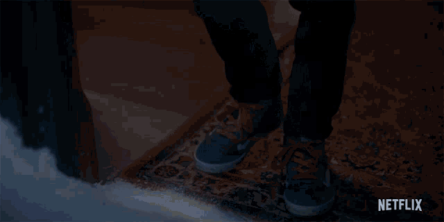 a close up of a person 's feet with a netflix logo in the corner