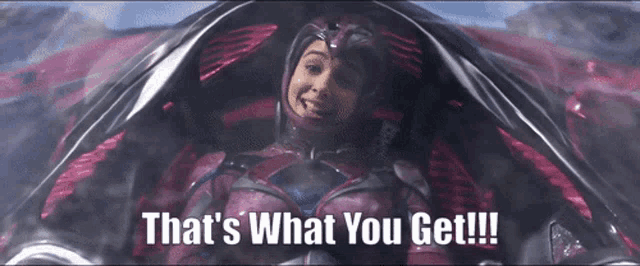a woman in a space suit is smiling and says that 's what you get !!!