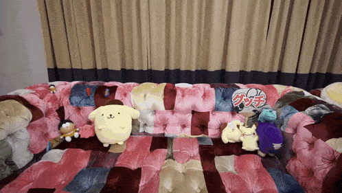 a couch with stuffed animals on it and a sign that says ' gucci ' on it