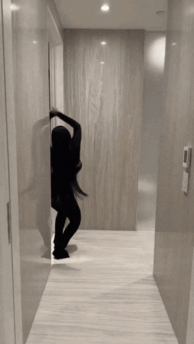 a woman is doing a yoga pose on the stairs