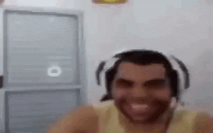 a man with headphones on his head is smiling .