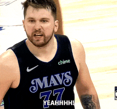 a basketball player wearing a mavs 77 jersey