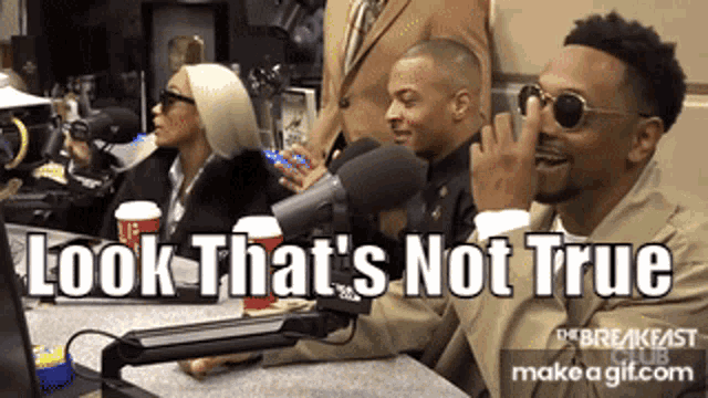 a group of people sitting in front of a microphone with the words look that 's not true above them