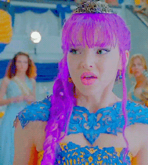 a woman with purple hair wears a blue and yellow dress