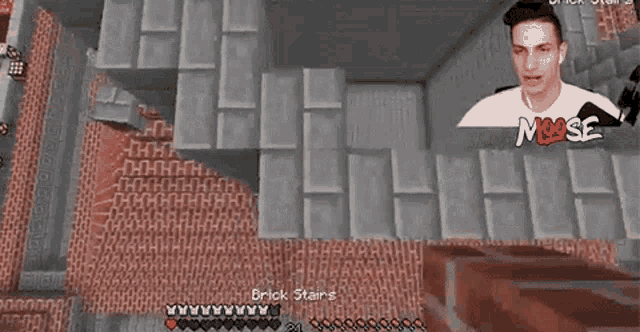 a man is playing a video game in a room with bricks .